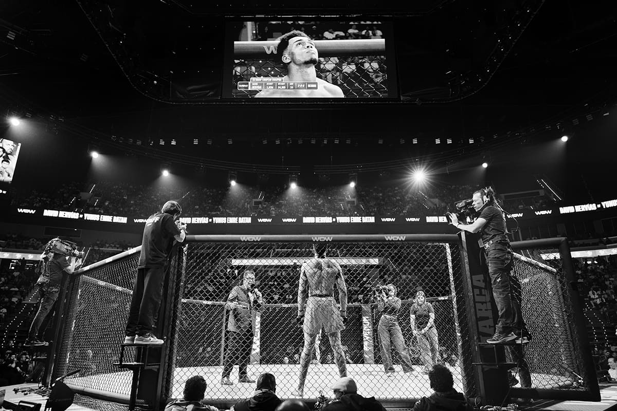 The announcer introduces David Hervias in the cage before his middleweight MMA bout at WOW 29 in Valencia.