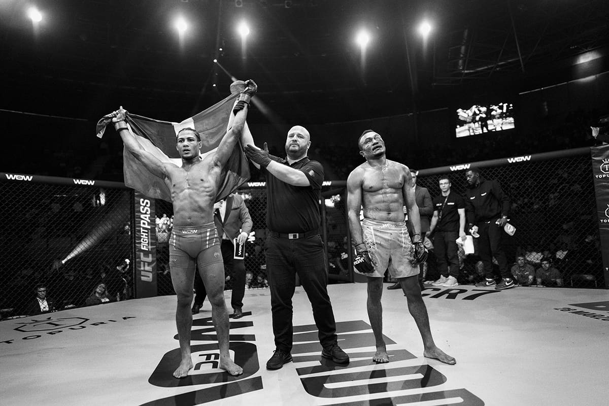 Delffy Humer celebrates his TKO win over Rafael Gemaque inside the cage after a flyweight MMA match at WOW 27 in Madrid.