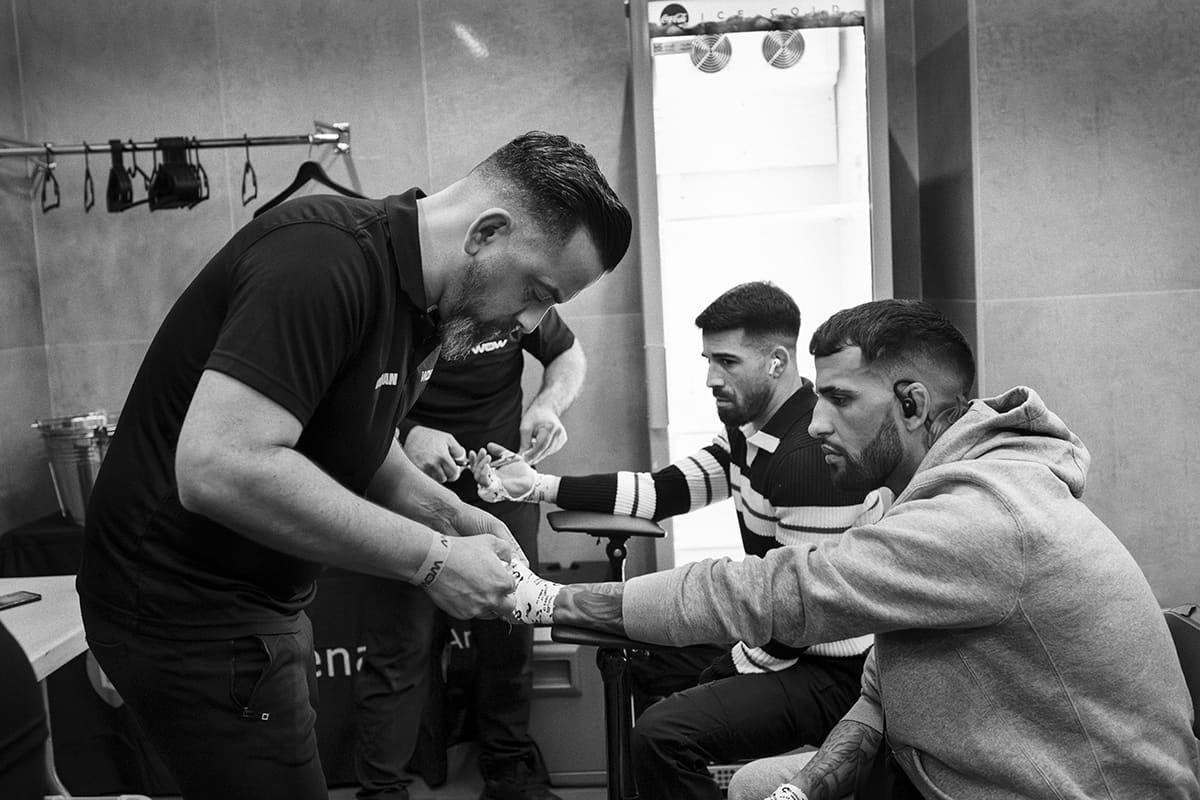 Fighters get their hands wrapped backstage before their bouts at the WOW 26 MMA event in Bilbao.