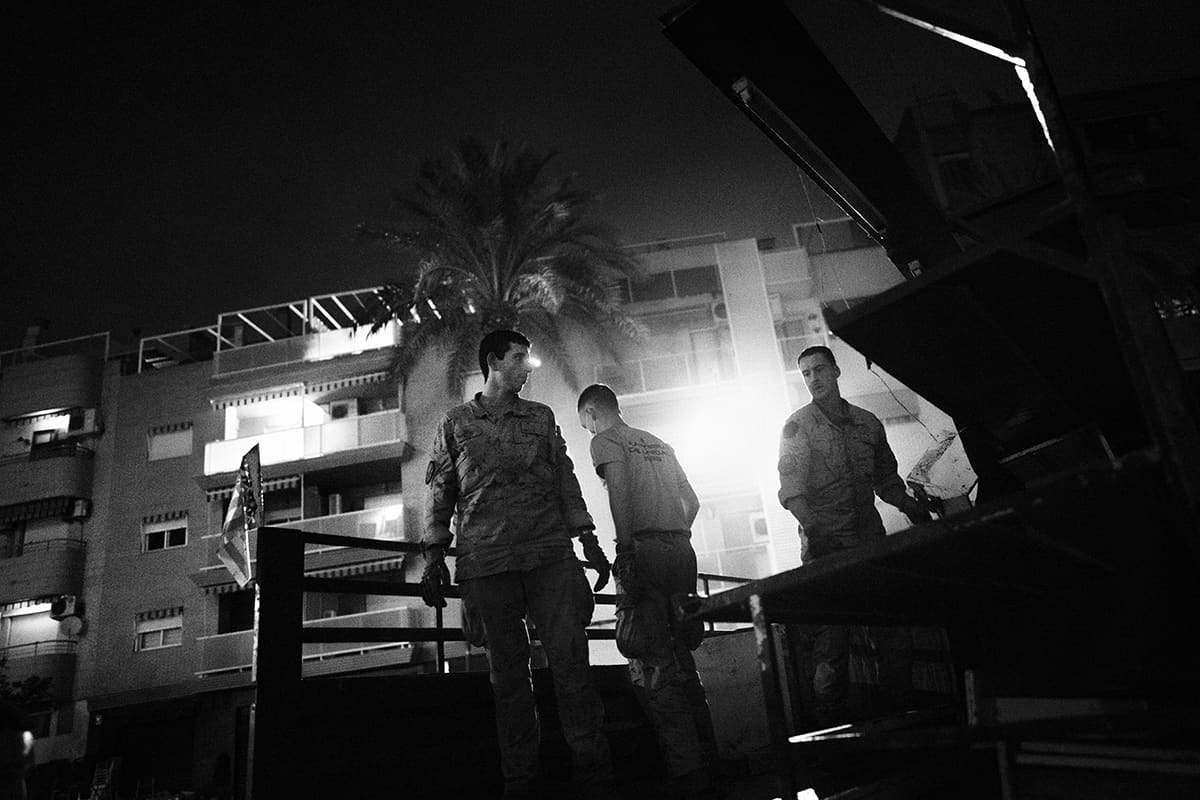 Spanish UME military unit performing debris-removal operations in the streets of Paiporta after the DANA