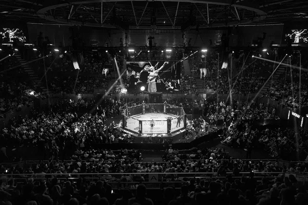 Thousands of fans fill the Madrid Arena during a high-profile WOW FC mixed martial arts event in Madrid.