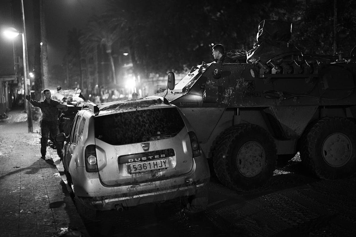Spanish military removing cars destroyed by the DANA flood from the streets of Paiporta, Valencia