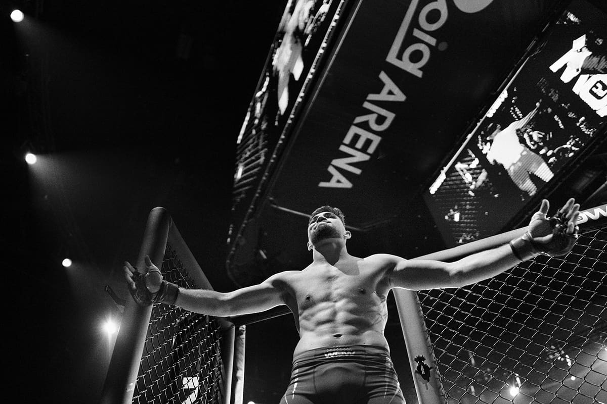 Antonio Fofirca celebrates a TKO win at Roig Arena during a WOW FC MMA event in Valencia.