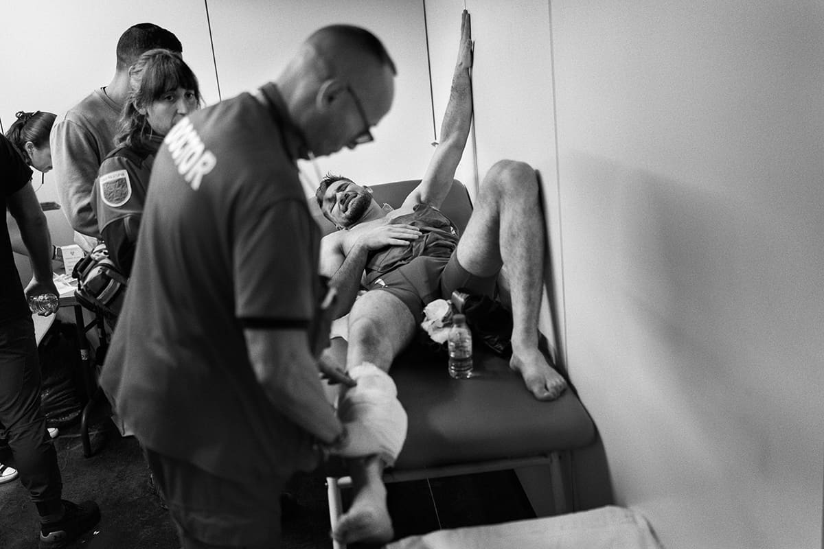 Antonio Fofirca receives medical care in the medical room after his professional MMA fight at WOW 25 in Madrid.