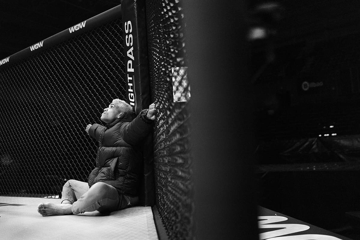 Jonny Becerra looks at the empty cage before his upcoming catchweight MMA fight at WOW 26 in Bilbao.