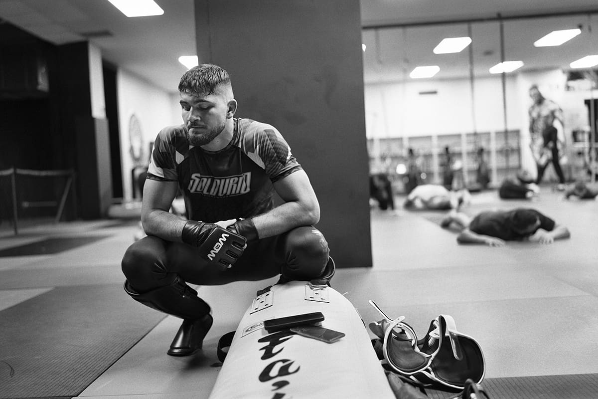 Antonio Fofirca rests between drills at The Black Panther Gym during an MMA training session in Madrid.
