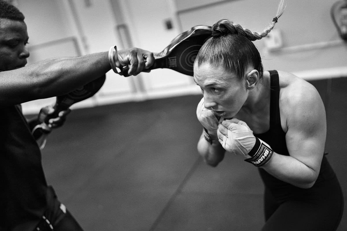 Isabel Calvo drills techniques with teammates at The Black Panther Gym during an MMA practice in Madrid.
