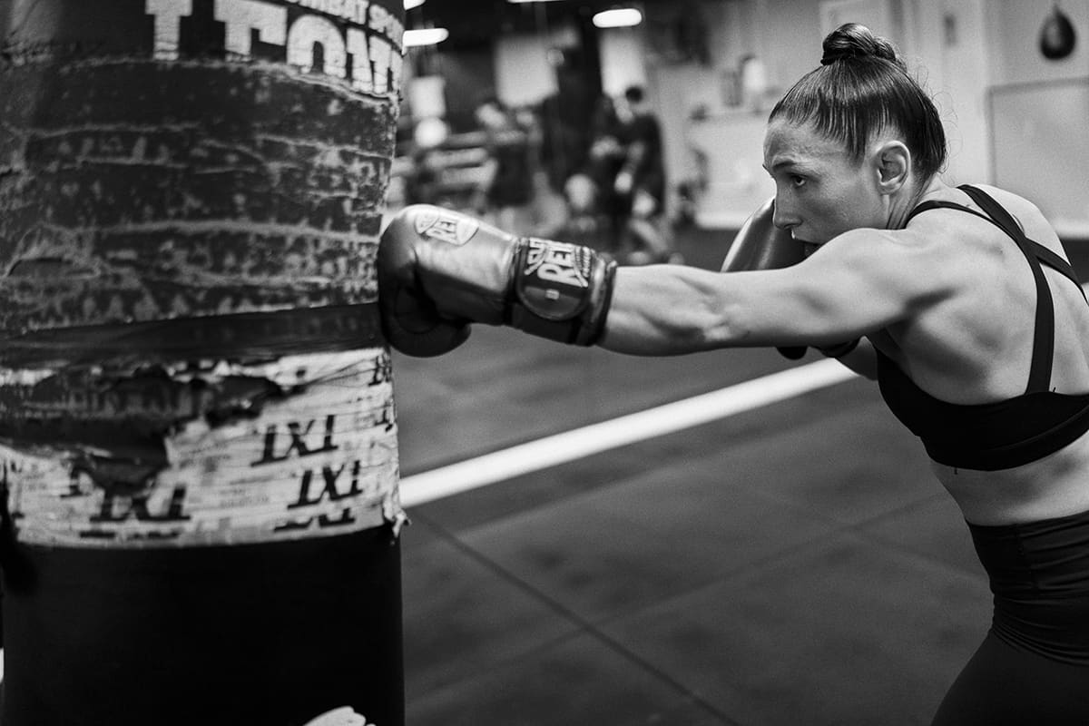 Isabel Calvo strikes a heavy bag at The Black Panther Gym in Madrid during MMA training for WOW 25.