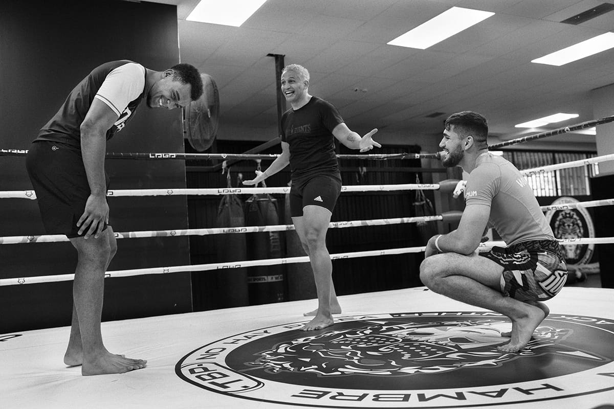 Antonio Fofirca practices drills with sparring partners at The Black Panther Gym during Madrid MMA training.
