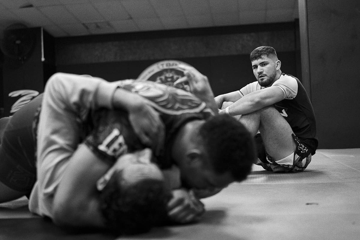 Antonio Fofirca listens to technical coaching instructions at The Black Panther Gym in Madrid during MMA training.