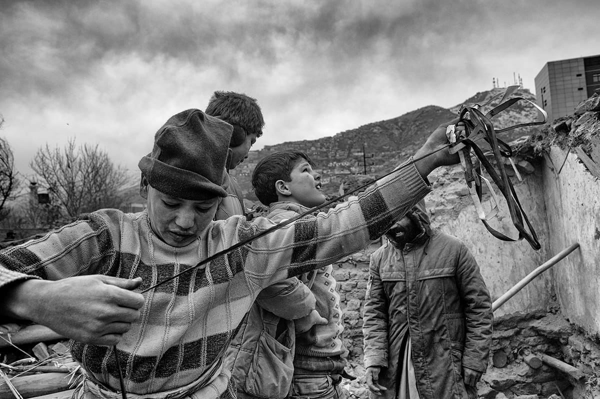 Afghan children working in the rubble of a destroyed neighbourhood of Kabul, February 2009