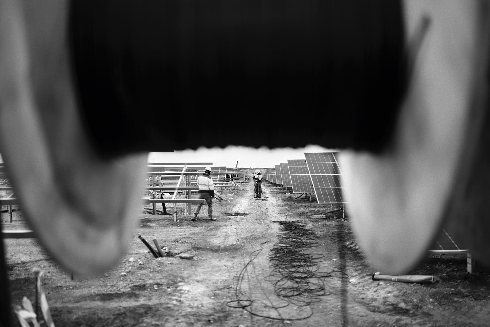 Workers assembling photovoltaic panels at a solar park in Andorra, Teruel, Spain, 2025