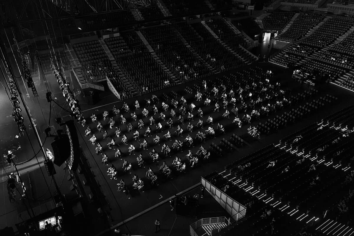 Aerial view of an arena with spectators seated far apart under social distancing rules during the COVID-19 pandemic in Spain.