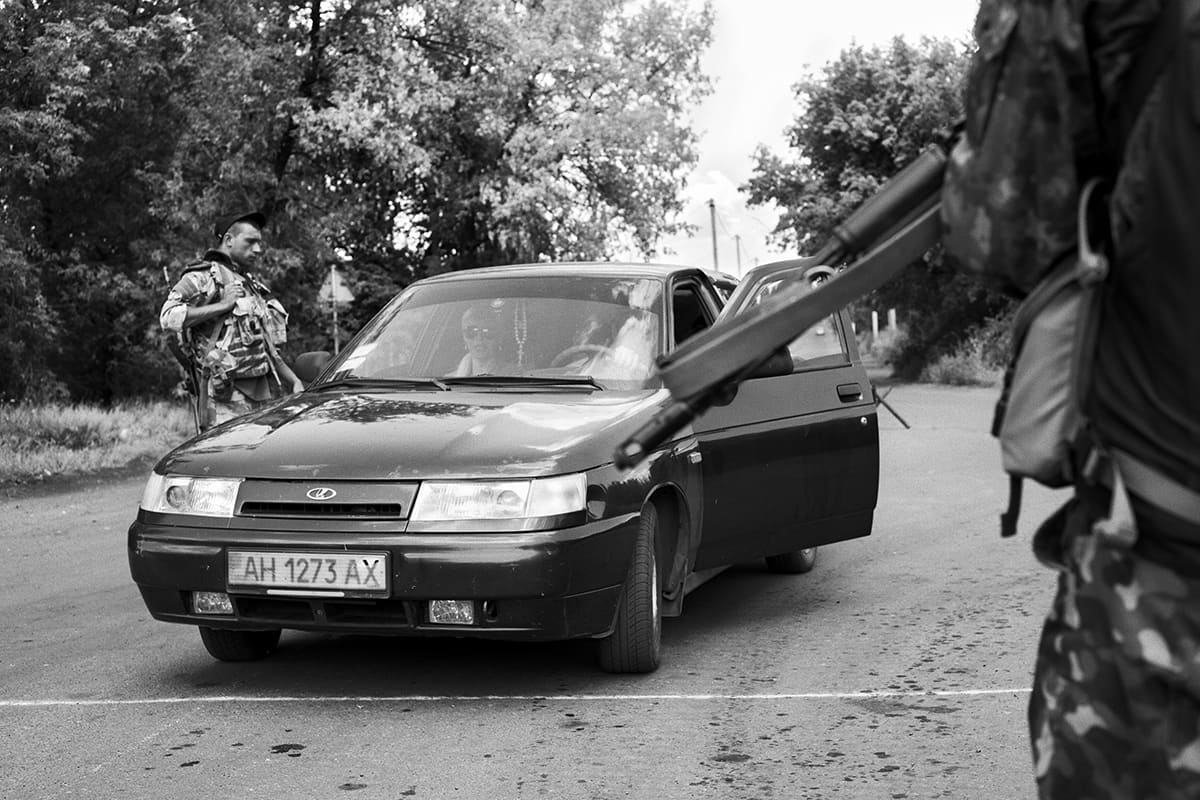 Ukrainian soldiers of the Kyiv territorial battalion man a checkpoint near Luhansk in eastern Ukraine.