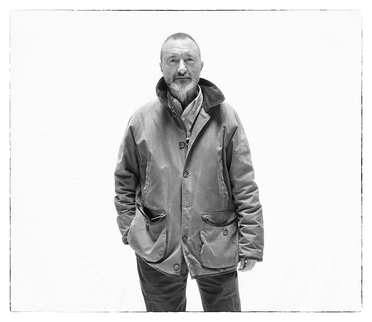Black and white studio portrait of Arturo Pérez-Reverte, writer, from the series Ñ by Álvaro Ybarra Zavala.