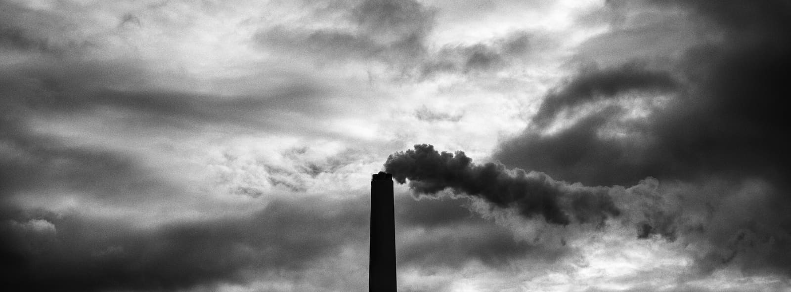As Pontes coal-fired power plant chimney releasing smoke before its closure, Galicia, Spain, 2021
