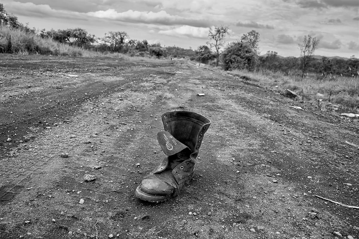 The boot of a dead Congolese army soldier abandoned on the road between Kibati and Rutshuru.