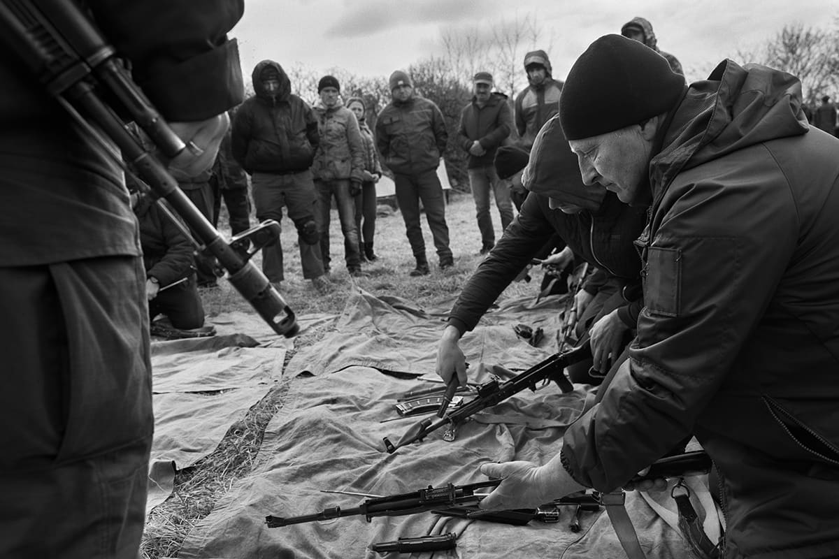 Civilian volunteers train as new recruits alongside members of the Ukrainian national guard near Lysychansk.