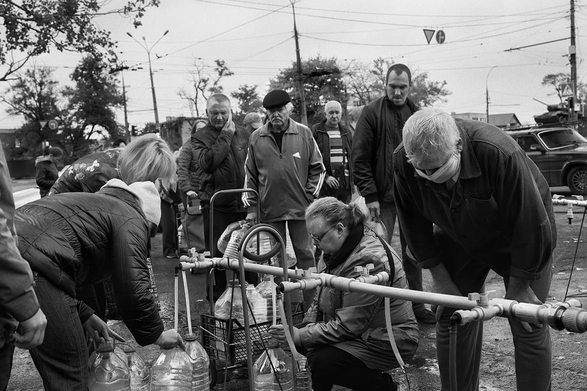 Residents of Mykolaiv queue to fill water containers after Russian shelling cut the city's supply.