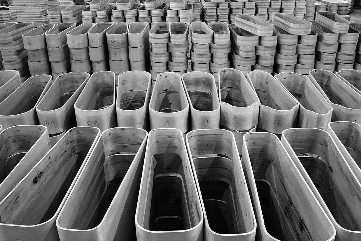 Rows of unfinished coffins stored in a Spanish workshop during the deadliest weeks of the COVID-19 pandemic.