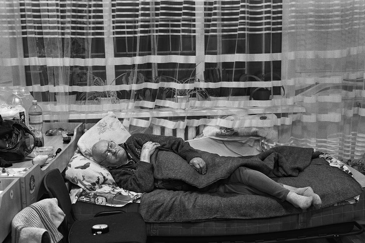 Serhiy, 79, rests inside the Mykolaiv school that has been his home since March.