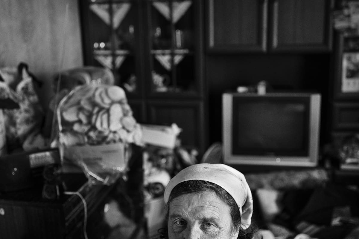 A woman inside her home in one of the outlying districts of Mykolaiv under constant Russian shelling.