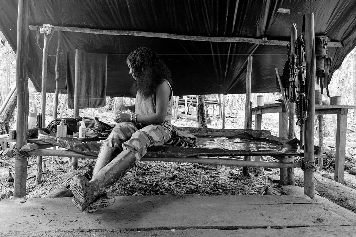 Female FARC guerrilla on guard duty inside a forest camp in southern Colombia, 2007