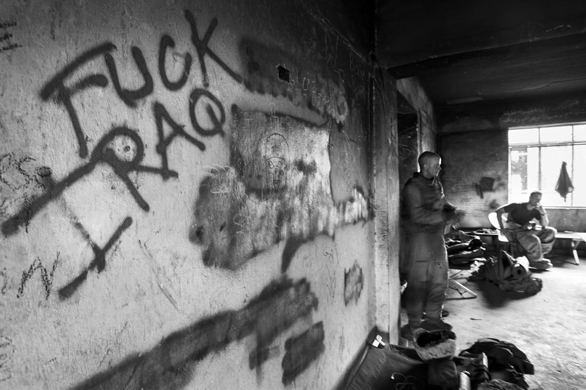 Graffiti reading 'FUCK IRAQ' scrawled on a destroyed wall inside the US Marines' Shoker base in Fallujah