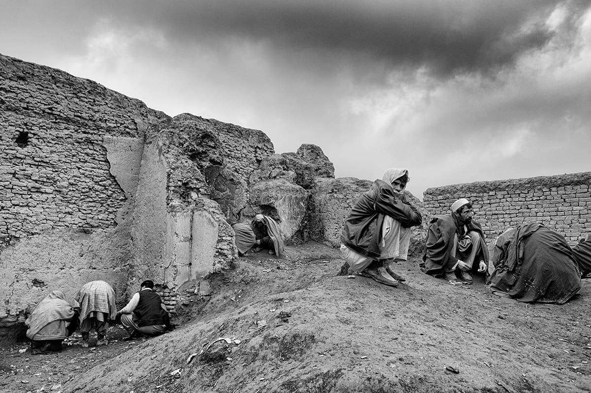 Group of heroin addicts among the ruins on the outskirts of Kabul, February 2009