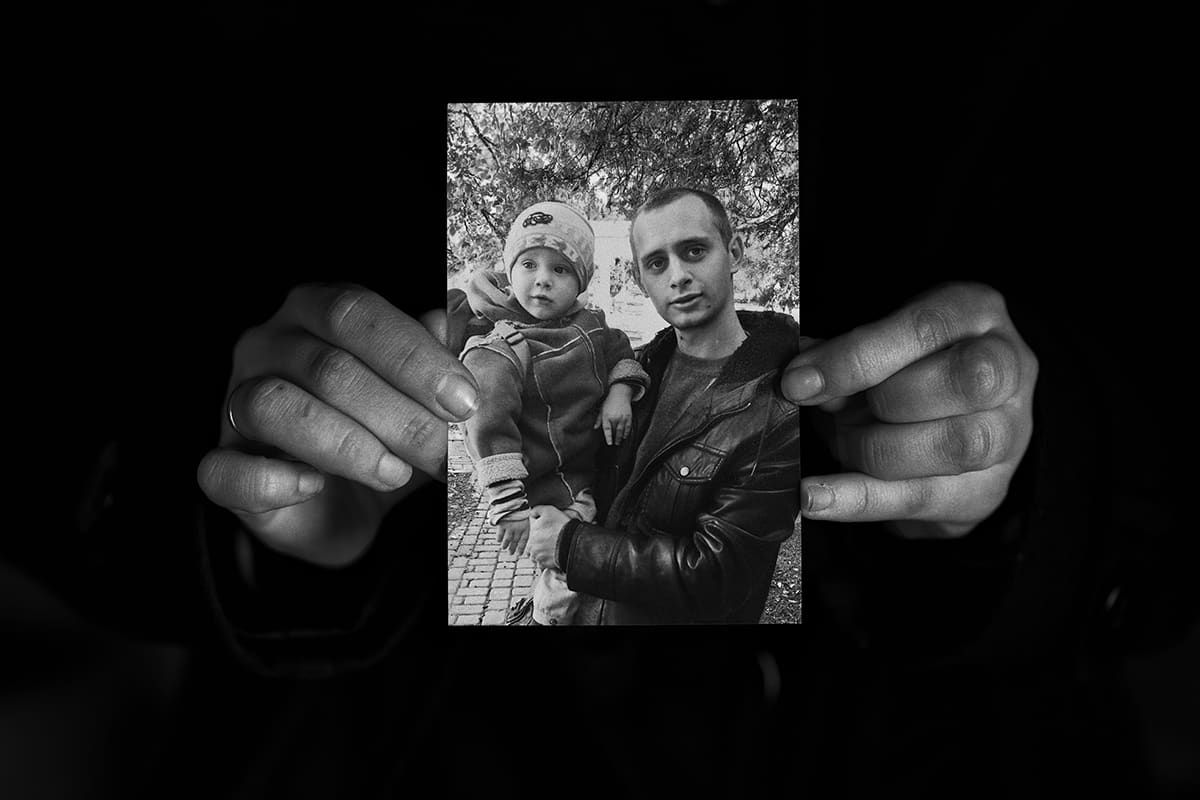 A photograph of Mykyta Horban with his son, held up by his wife Nadia after he was taken away by Russian troops.