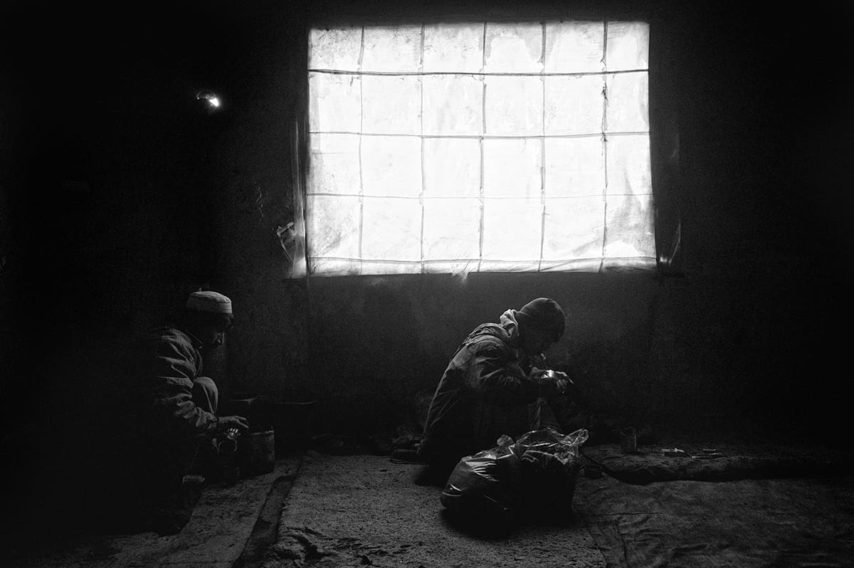 Heroin addicts inside the abandoned Russian Cultural Centre in Kabul, used as a shooting gallery, February 2009