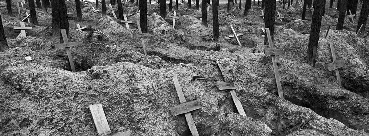 Mass grave in Izium where Ukrainian authorities exhumed more than 400 bodies after the town's liberation.