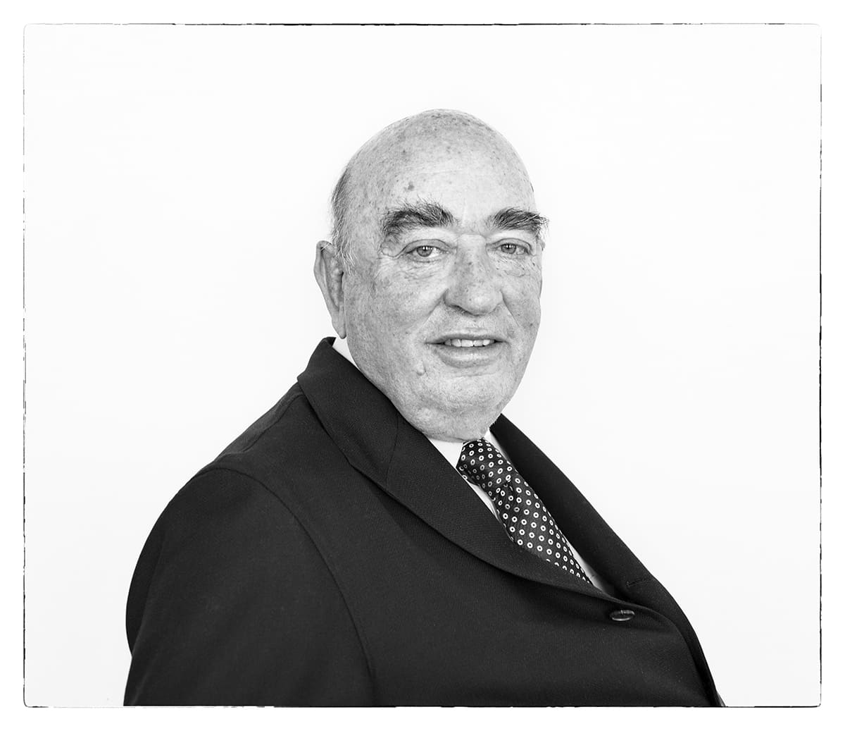 Black and white studio portrait of José Lladó, businessman, from the series Ñ by Álvaro Ybarra Zavala.