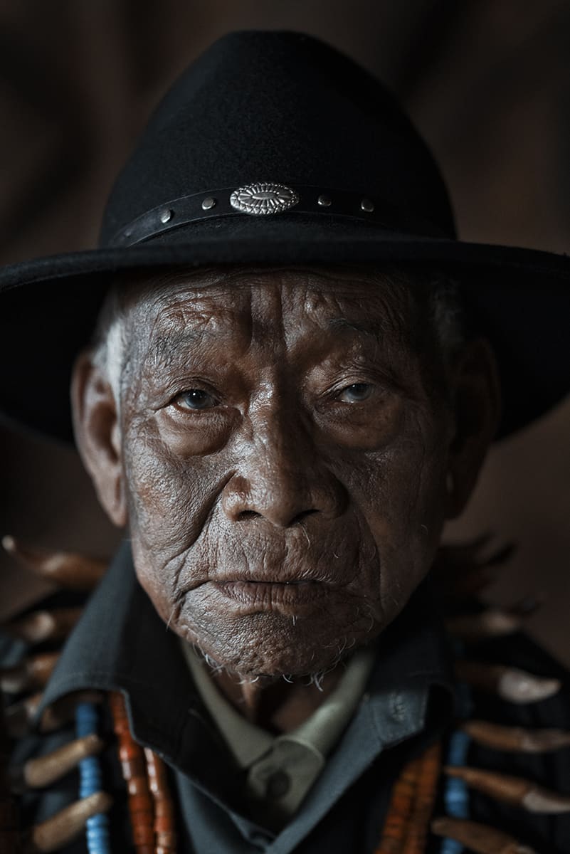 Konyak elder in a black hat with beaded necklaces, Nagaland, north-east India.