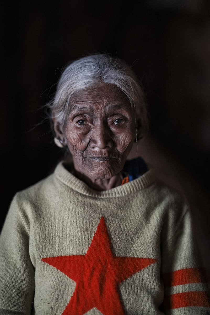 Elderly Konyak woman photographed in her village in the Mon district of Nagaland, India.