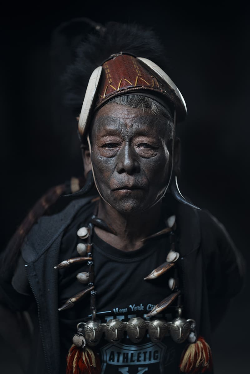 Konyak warrior in ceremonial headdress and brass heads necklace, Nagaland, India.