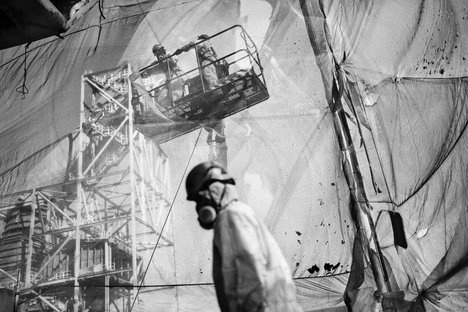 Workers inside a safety enclosure dismantling the Litoral thermal power plant, Almería, Spain, 2023