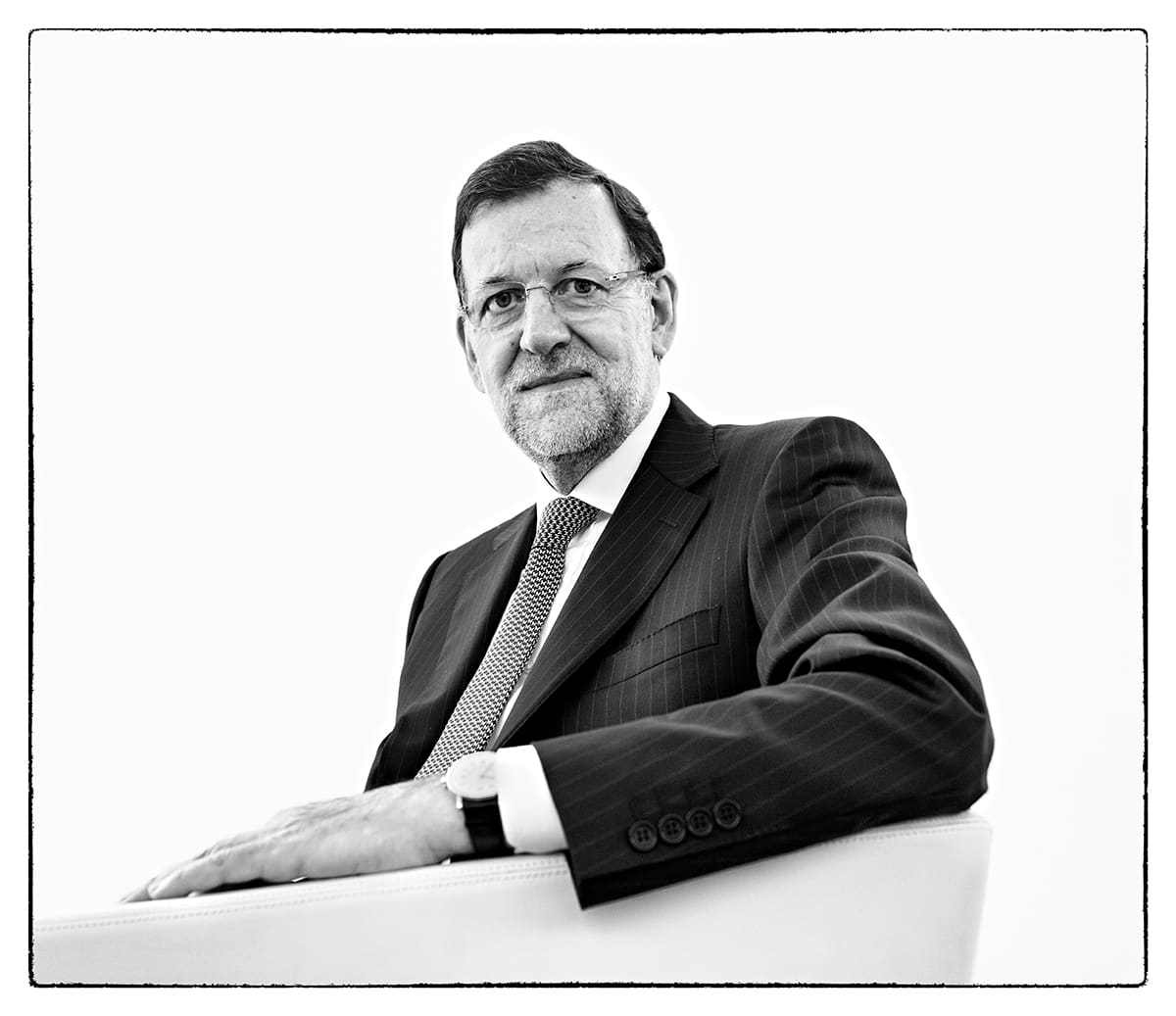 Black and white studio portrait of Mariano Rajoy, Prime Minister of Spain, from the series Ñ by Álvaro Ybarra Zavala.