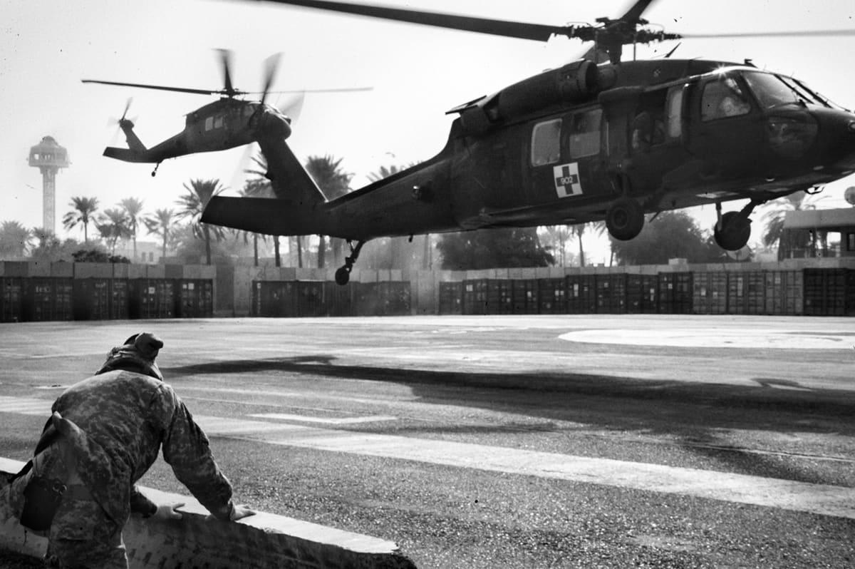 A Medevac Black Hawk helicopter lands at the rear of the 28th Combat Support Hospital, known as 'China Dragon', in Baghdad