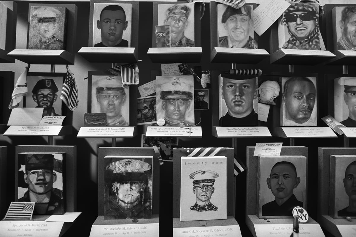 A memorial wall displaying portraits and names of US soldiers killed in Iraq and Afghanistan, in Washington DC