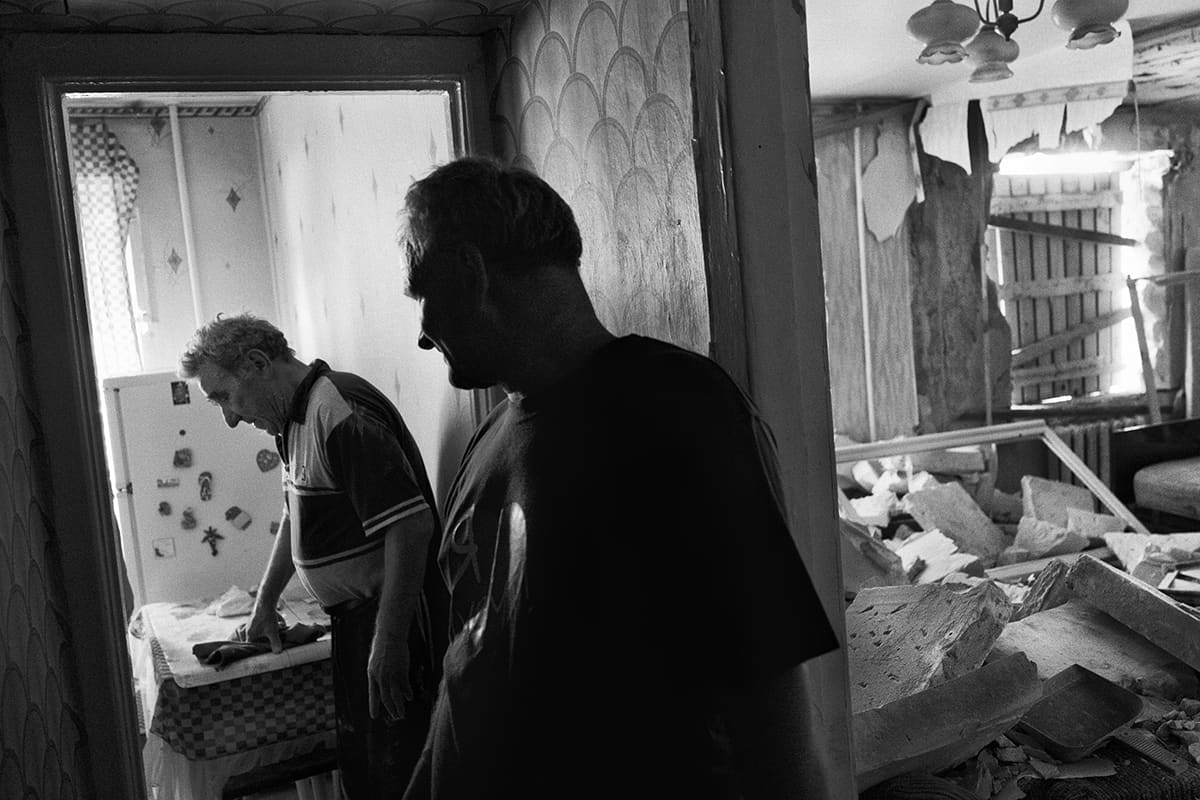 Vladimir and Jacob inside their destroyed house in the village of Mykolaivka, near Sloviansk.