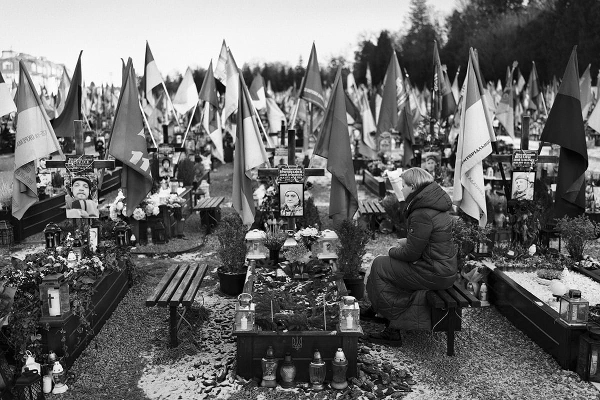 Victoria Trybushna visits her husband's grave at Lychakiv cemetery in Lviv.
