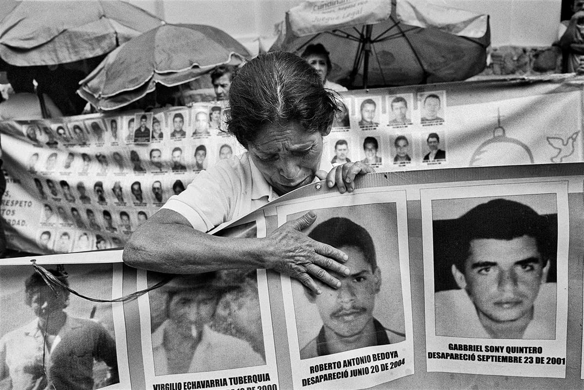 Mother weeps during the weekly vigil of Madres de la Candelaria for the disappeared, Antioquia, 2015