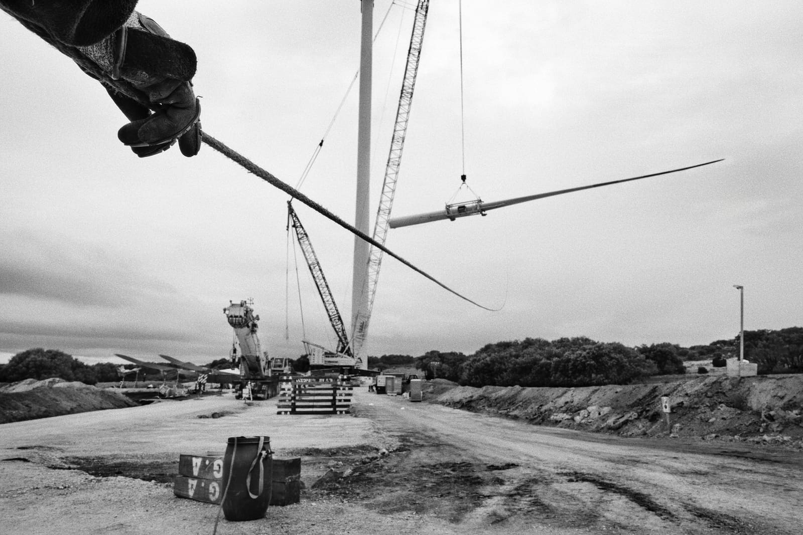Worker guiding a wind turbine blade during assembly at the Muniesa wind farm, Teruel, Spain, 2024