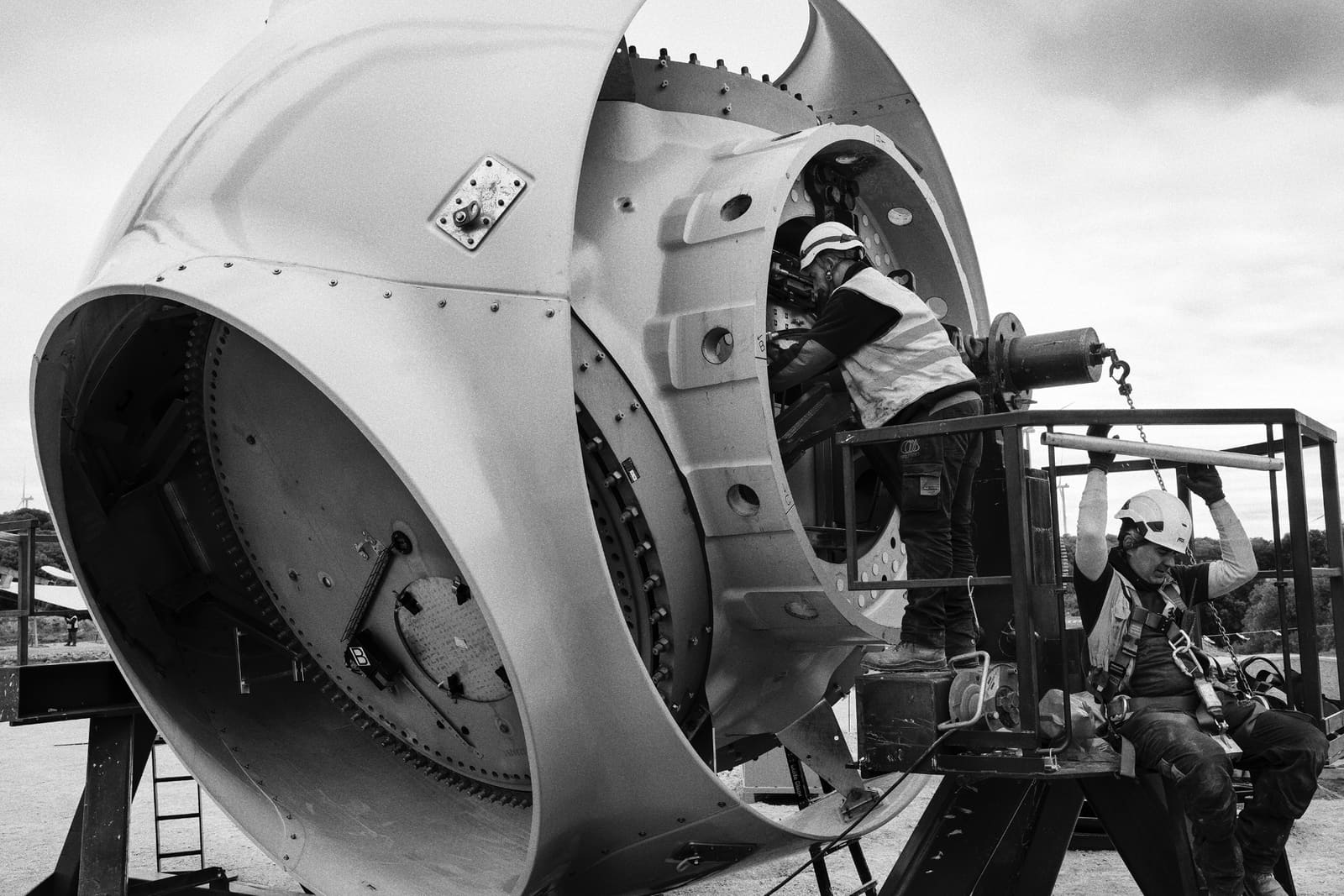 Workers operating inside the rotor of a wind turbine at the Muniesa wind farm, Teruel, Spain, 2024