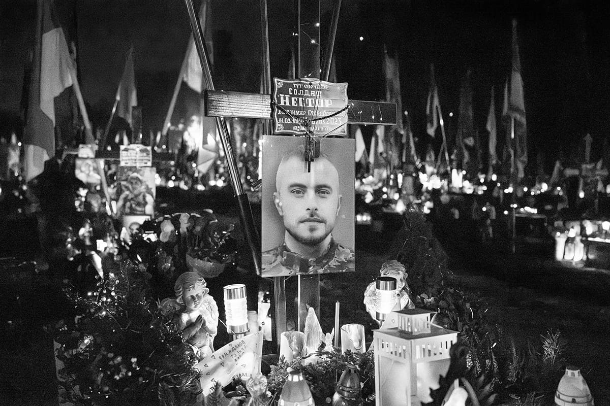 A portrait of Volodymyr Nestor adorns his grave at the Lychakiv Military Cemetery in Lviv.