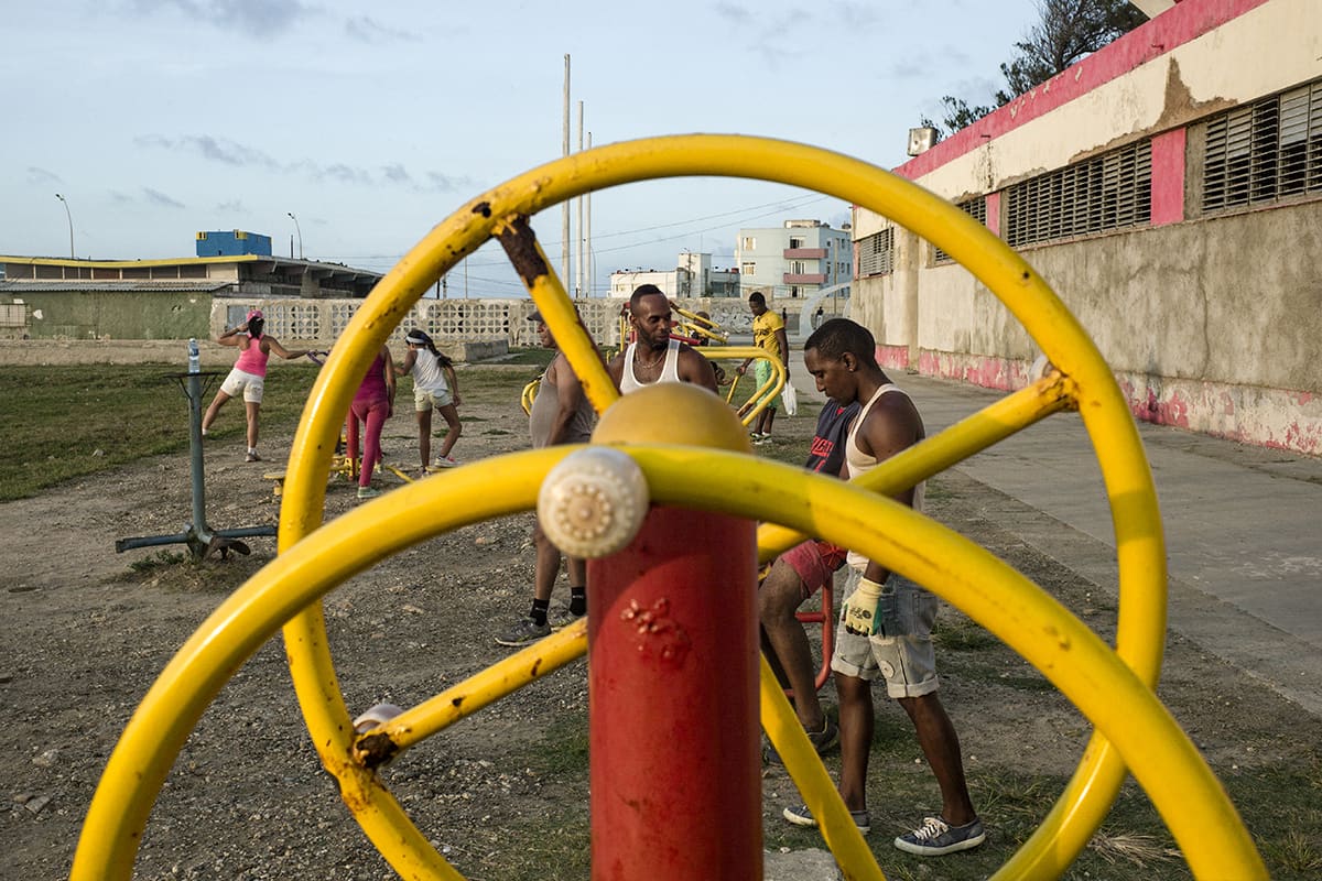 Cubans exercising in an open-air sports area in Havana.