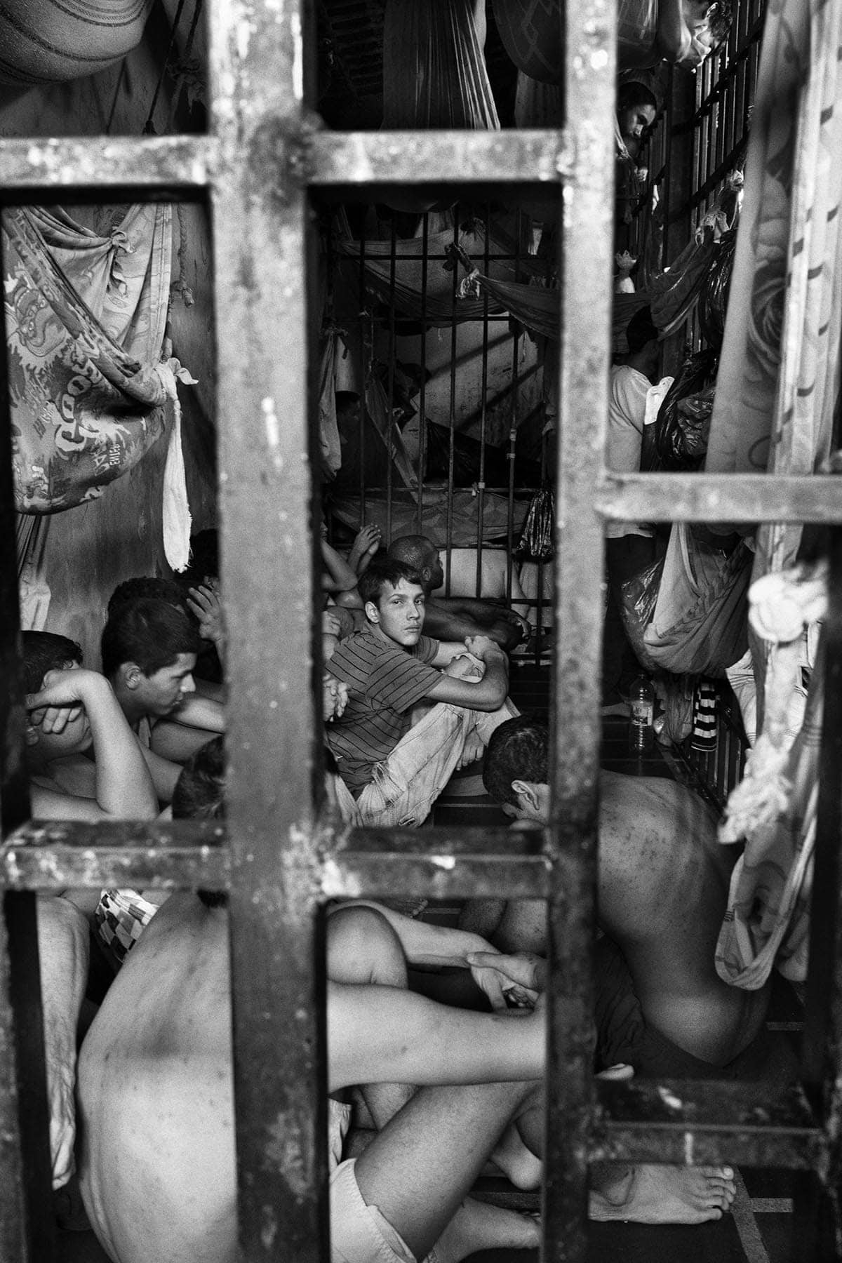 Prisoners locked inside cells at the municipal police station of Chacao, eastern Caracas