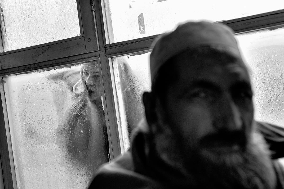 Patient at the window of the Institute for Malaria and Leishmaniasis waiting room, Kabul, February 2009