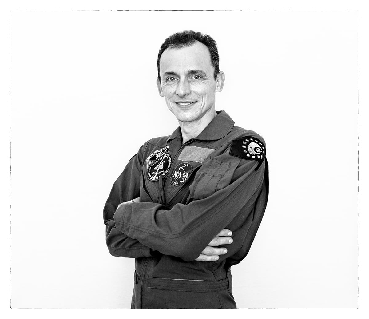 Black and white studio portrait of Pedro Duque, astronaut and engineer, from the series Ñ by Álvaro Ybarra Zavala.